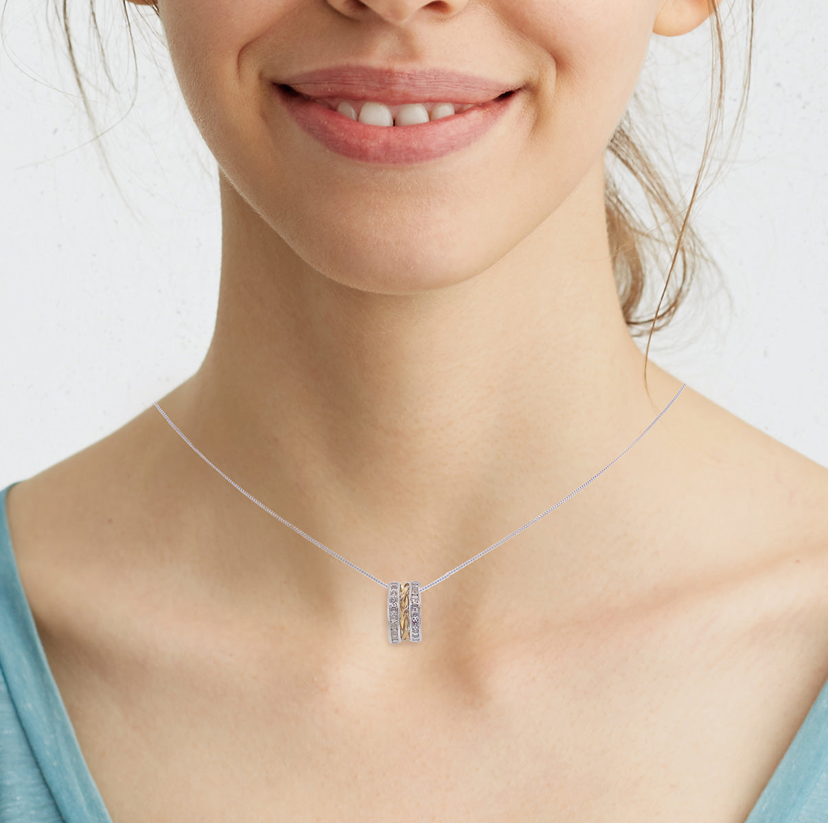 9K 2-TONE GOLD CZ 7MM X 13MM TWINED 3-RING PENDANT