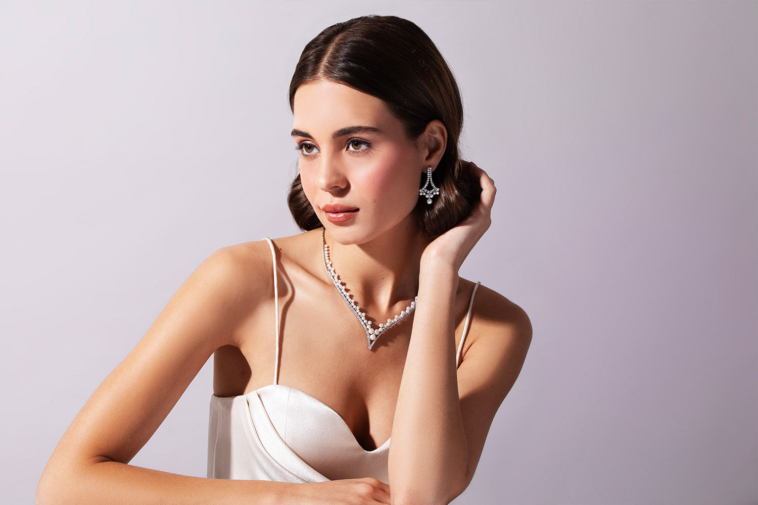 model wearing yoko london pearl jewellery
