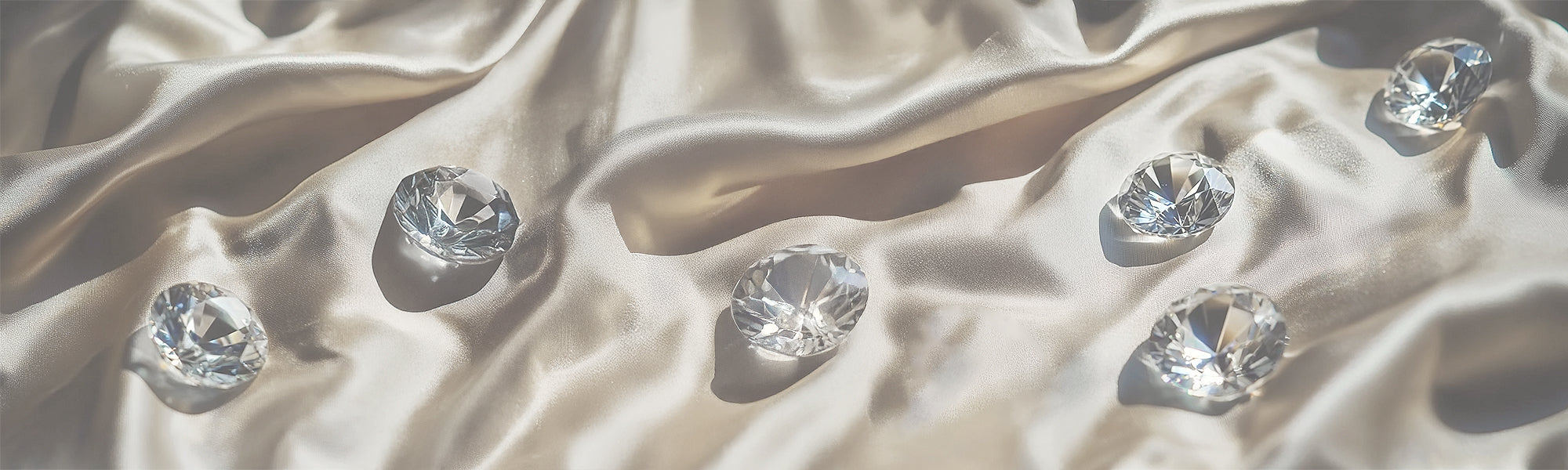 round brilliant cut diamonds on silk