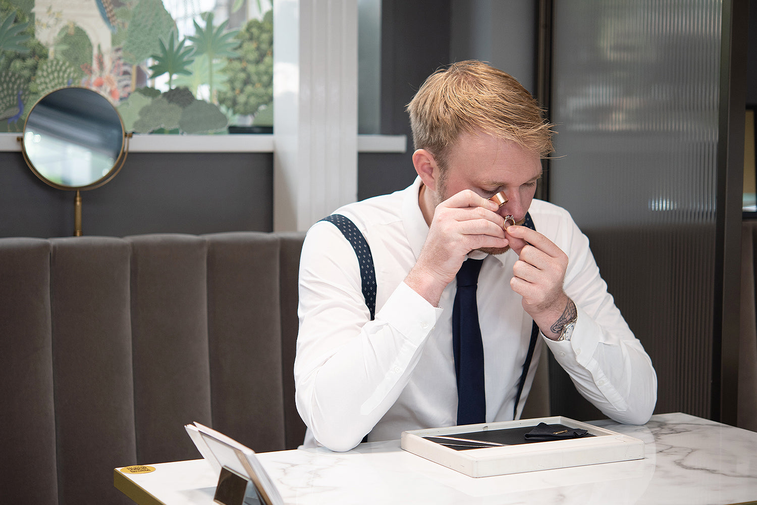 A member of the JQ team QA checking a diamond ring